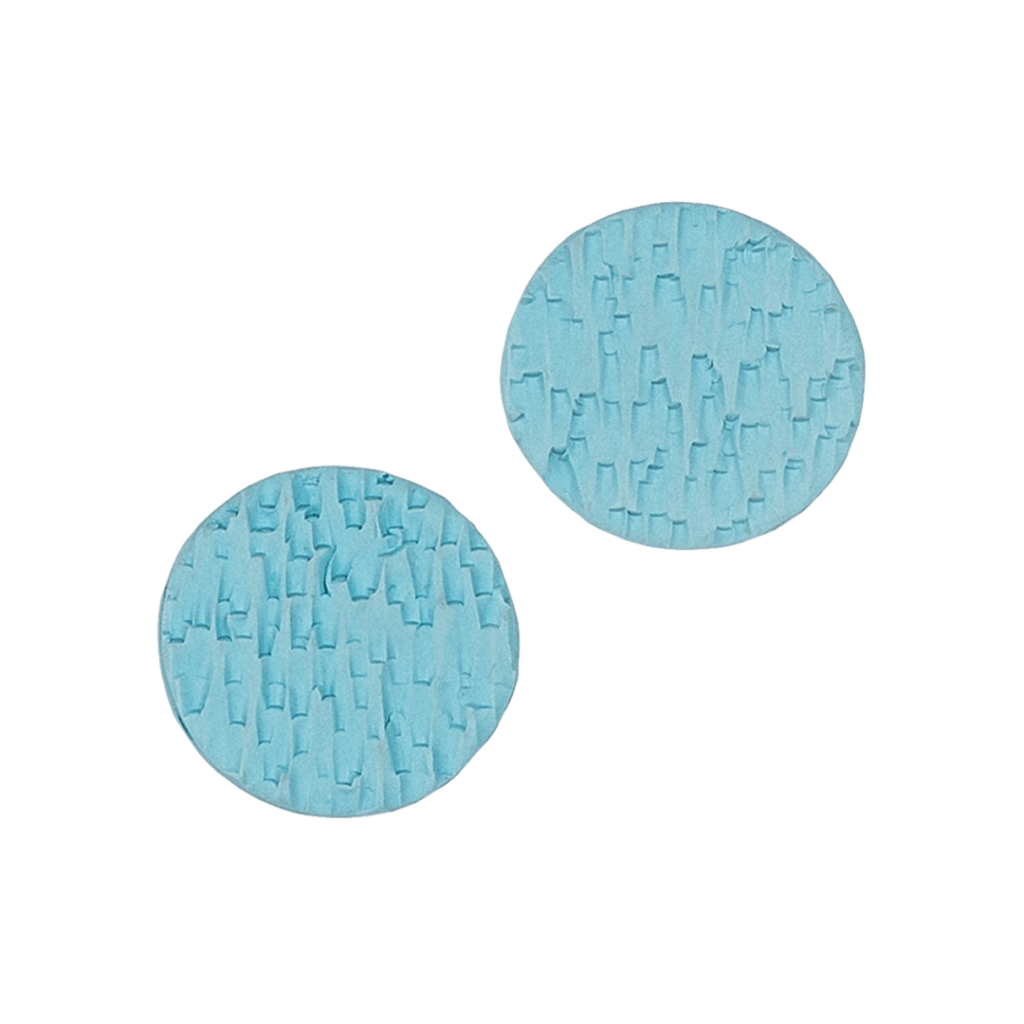 Handcrafted compact polymer clay studs featuring Heloise Jewelry's signature texture in Sky Blue. These versatile pieces blend practical design with professional elegance. Perfect for active lifestyles.