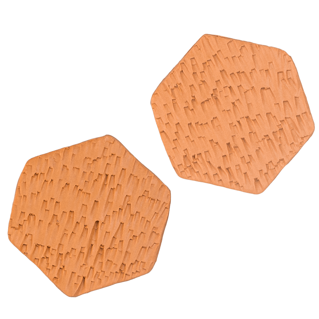 Héloïse Jewelry—The Tangerine Hex Stud Earrings Handcrafted hexagonal polymer clay studs by Héloïse Jewelry featuring signature texture in vibrant tangerine. These distinctive geometric pieces blend modern design with professional elegance. Perfect for confident style.